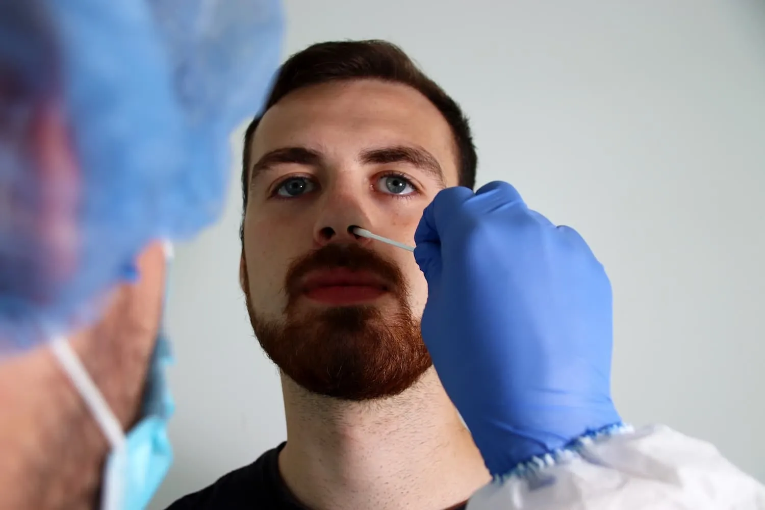 Pharmacist preparing a COVID-19 test sample